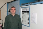 About Paul Thurst standing in front of a Nautel XL60 medium wave transmitter
