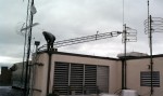 Damaged Rohn 25G STL tower on roof of studio
