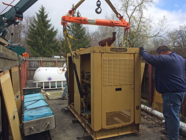 Katolight Genset hooked up to the crane, ready to move